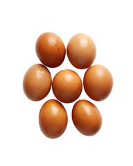 Seven brown eggs arranged in a circle on black background