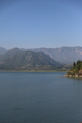 Vertical lake, panorama of Skadar lake, mountains, sky background