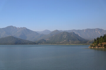 View of Lake Skadar, mountains, sky in the background