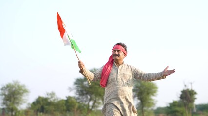 Indian  farmer waving flag at agriculture field 