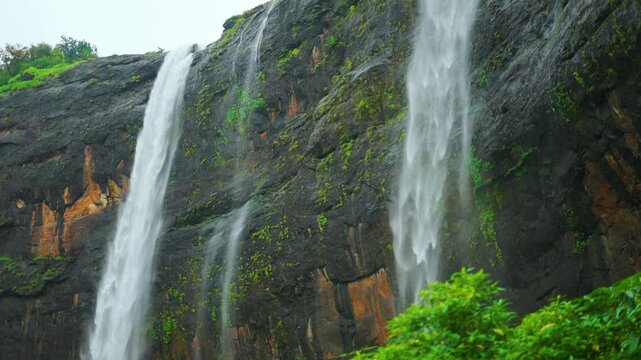 4K Slow motion shot of Kataldhaar waterfall falling from a cliff during the monsoon season near Lonavala in Maharashtra, India. Scenic view of waterfall falling from a cliff during the rainy season.