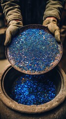 Intangible heritage artisan painting cloisonné, macro shot of cobalt blue pigment on copper, Pantone 19-4052TCX (imperial blue)