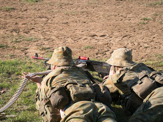 Australian Army Reserve Exercise - Two Soldiers Lying with Gun and Bullets