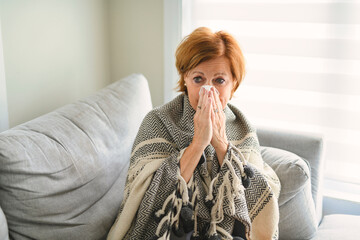 women with stress that suffer from allergies and close the nose with tissue paper. Because of...