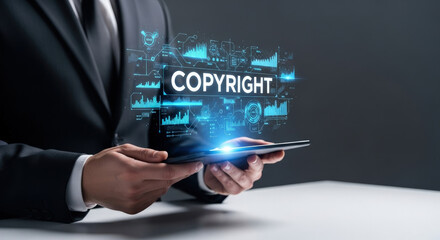 Copyright Law and Digital Rights Management Concept: Businessman Holding Tablet with Hologram of Copyright Text and Data Visualization Overlay