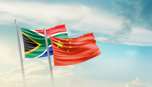 South Africa and China flags waving in beautiful sky. Two country flag for agreement or deal. South Africa China national flag for commitment.