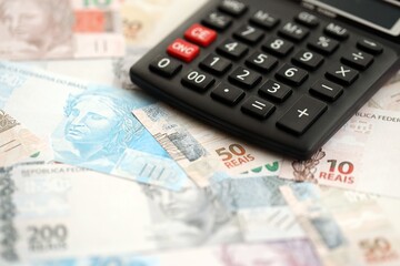 Brazilian reais banknotes and calculator. The current Brazil real money bills and calculator