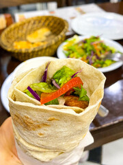 Traditional local Turkish dish and dinner, wrap kebab salad and chicken soup 