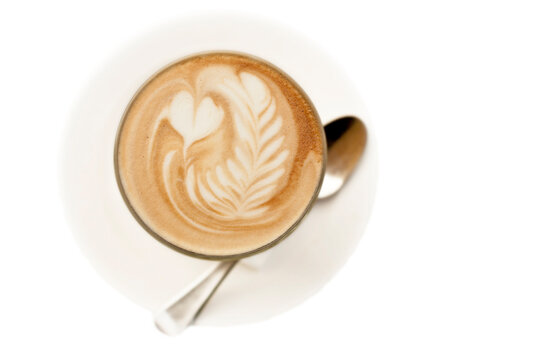 Flat white coffee with latte art featuring hearts and rosetta