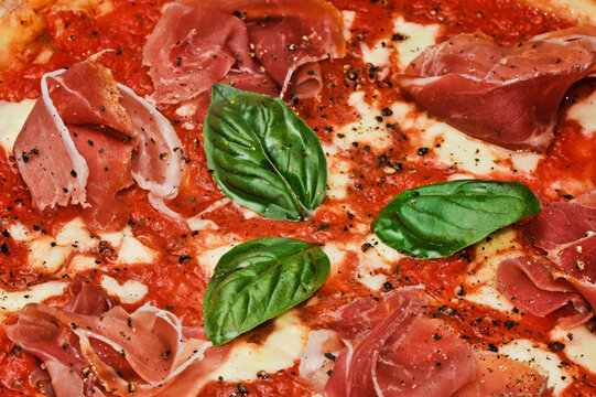 simple  pizza with basil leaves