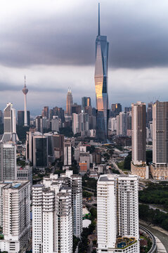 Merdeka 118 tower and office buildings reflecting sunset in Kuala Lumpur, Malaysia