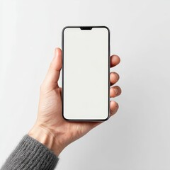 A person holding a phone with a blank screen