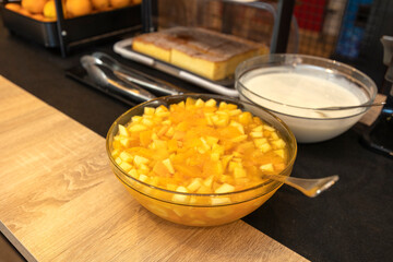Bowl of fresh fruit salad displayed on breakfast buffet table