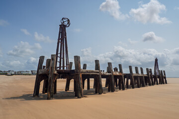 old ruined landing stage of st annes pier formerly used as a dock for cruise ships on the beach in...