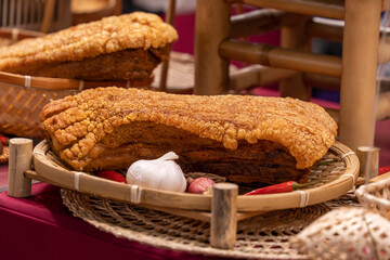 Close-up view of the crispy pork belly selling at the food stall, it features a thick slab of pork...