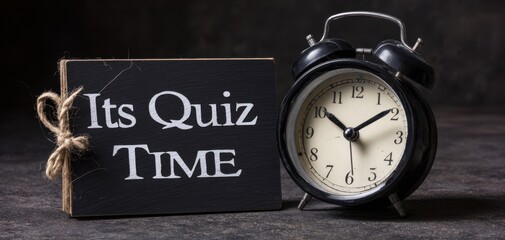 The black alarm clock and chalkboard announce it's quiz time!