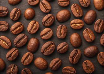 Naklejka premium Roasted Coffee Beans on Dark Wooden Table—Aromatic Close-up from Above