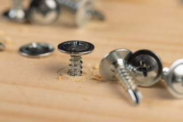 screw for fixing boards and other wood materials, self-tapping screws with a drill tip twisted into...
