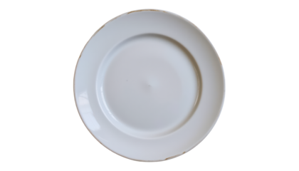 a plate with a design resembling a target or bullseye, set against a simple background that contrasts with the plate's color