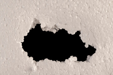 foam made from a large number of pieces joined together, close up, a hole in the foam