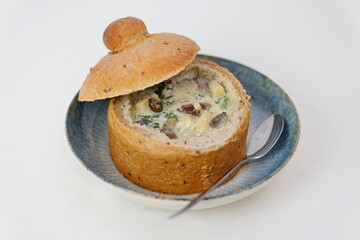 in bread soup with mushrooms restaurant serving baked bowl Homemade Broccoli Cheddar Soup in a Bread Bowl Ready to Eat