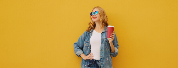 Summer joyful young woman with cup of coffee, stylish modern girl holding juice in casual clothes