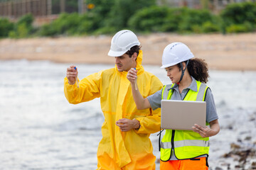 Environmental Scientists Collecting Water Samples for Analysis, Researchers Testing Water Quality at a Lake or Coastal Area, Water Pollution Control, Scientists Team at Work in the Field