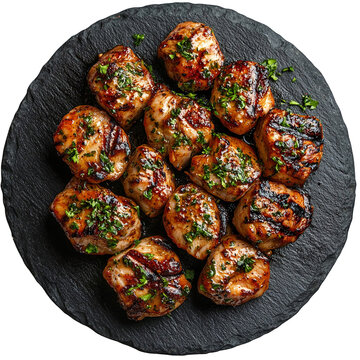 Top view of a delicious looking karides g&uuml;ve&ccedil; on a dark stone plate isolated on a white transparent background
