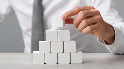 A professional building with white cubes, symbolizing growth and teamwork in a corporate environment.