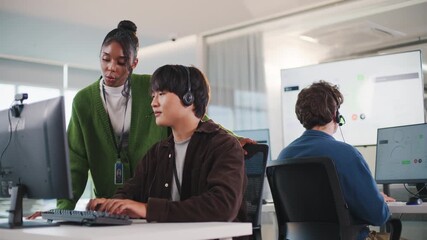 Business meeting at tech support call center showcasing teamwork with headsets and computers in modern office environment providing efficient call center support and collaboration - Powered by Adobe