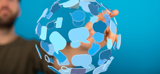 Image of a hand interacting with a digital sphere of speech bubbles, symbolizing global...