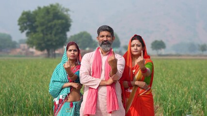 indian farmer and women showing voting sign  - Powered by Adobe