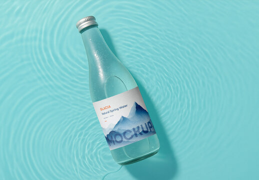 Mineral Water Bottle Mockup Floating in Clear Blue Water with Ripples
