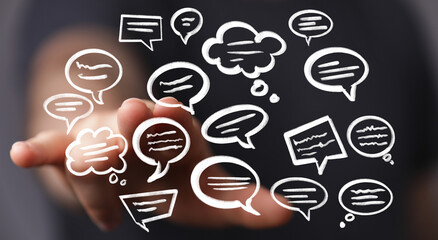 Image depicts hand interacting with various speech bubbles, symbolizing communication, dialogue,...