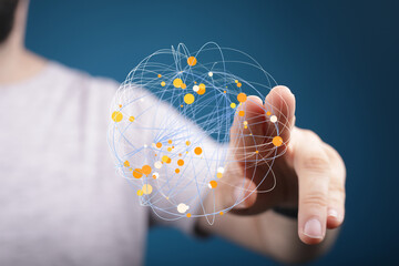 Person interacts with a digital sphere, representing global connections and data visualization.