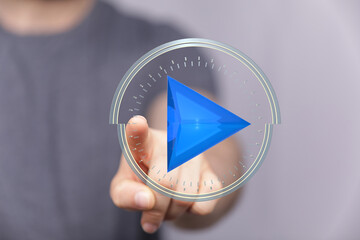 Abstract image of a hand pressing a play button.  Perfect for technology, media, and digital...