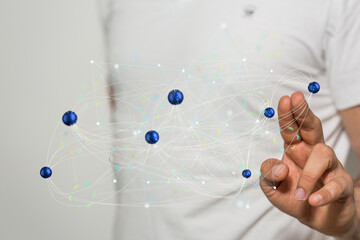 Person interacts with a digital network, showcasing global connectivity and data flow.