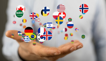 Image of diverse national flags floating above a hand, symbolizing global communication and...