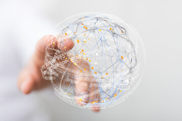 Abstract image of a hand interacting with a digital sphere representing a global network.