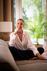 Full length of an attractive mature woman relaxing in her cozy home