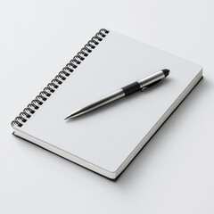 White spiral notebook with silver pen on white background