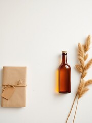 Fototapeta premium Simple presentation A packaged gift with natural twine, glass bottle, and dried ornamental grass against a white background