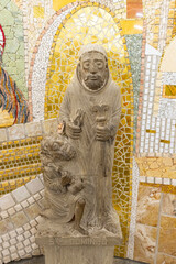 Stone statue of Santo Domingo helping a pilgrim in Santo Domingo de la Calzada, La Rioja, Spain