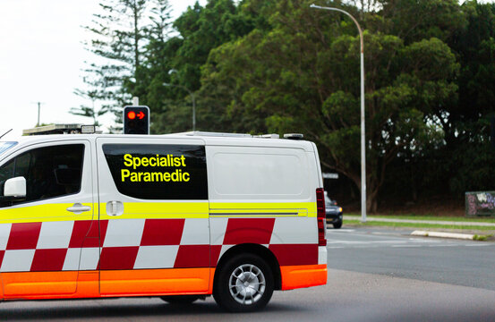 specialist paramedic ambulance vehicle passing at intersection on street