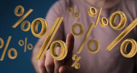 Person interacting with 3D golden percentage symbols.  Great for finance, sales, discount concepts.