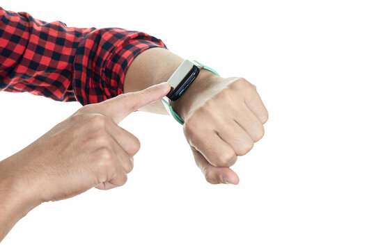 Man in a plaid shirt pointing at a modern smartwatch. Concept for checking time, fitness tracker app, or a business deadline, isolated on white background with clipping path.