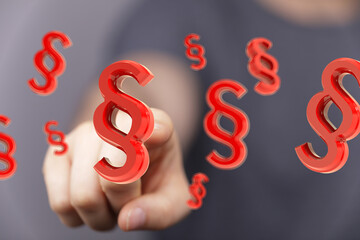 3D rendering of red paragraph symbols floating, legal concept.