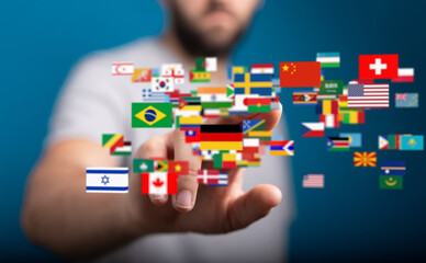 Person touching digital world flags, representing global communication and international business.