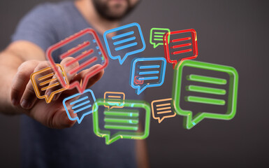 Abstract image of a person interacting with colorful chat bubbles, representing communication,...