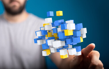 Abstract image of a person interacting with floating 3D data cubes, representing digital...